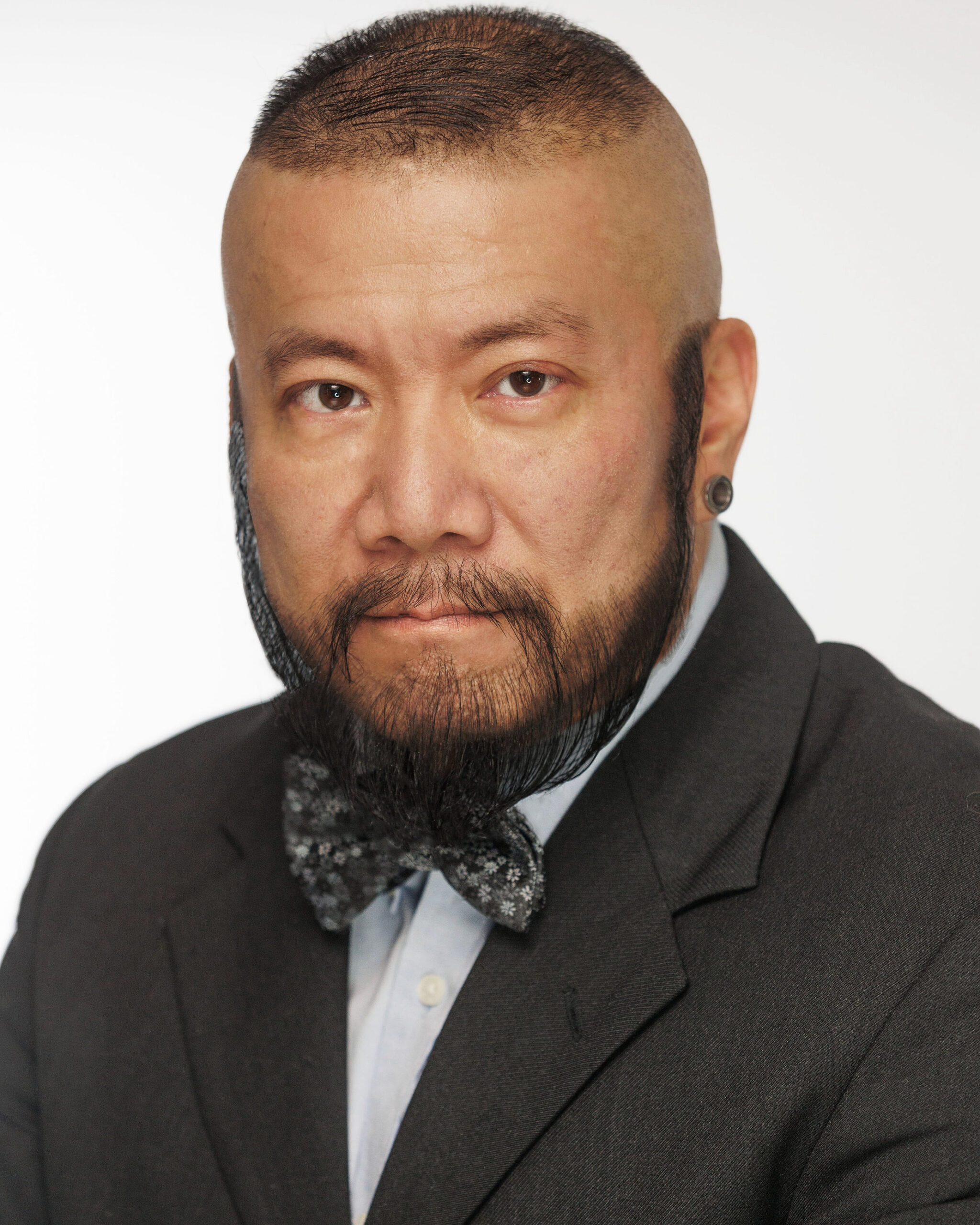 Harry Konner's Headshot: Bow Tie - Side Gaze Serious