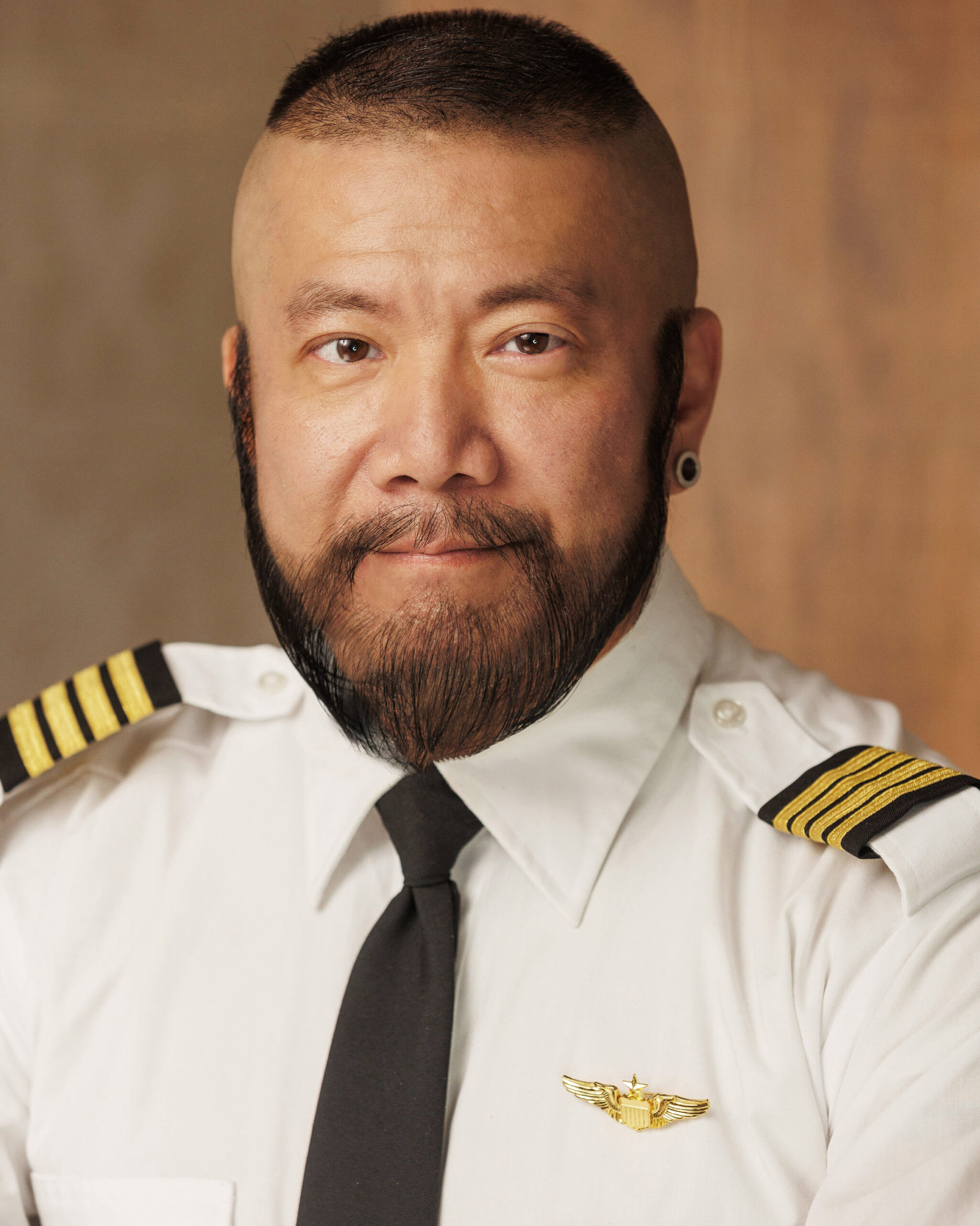 Harry Konner's Headshot: Airline Pilot - Side Gaze with Smile