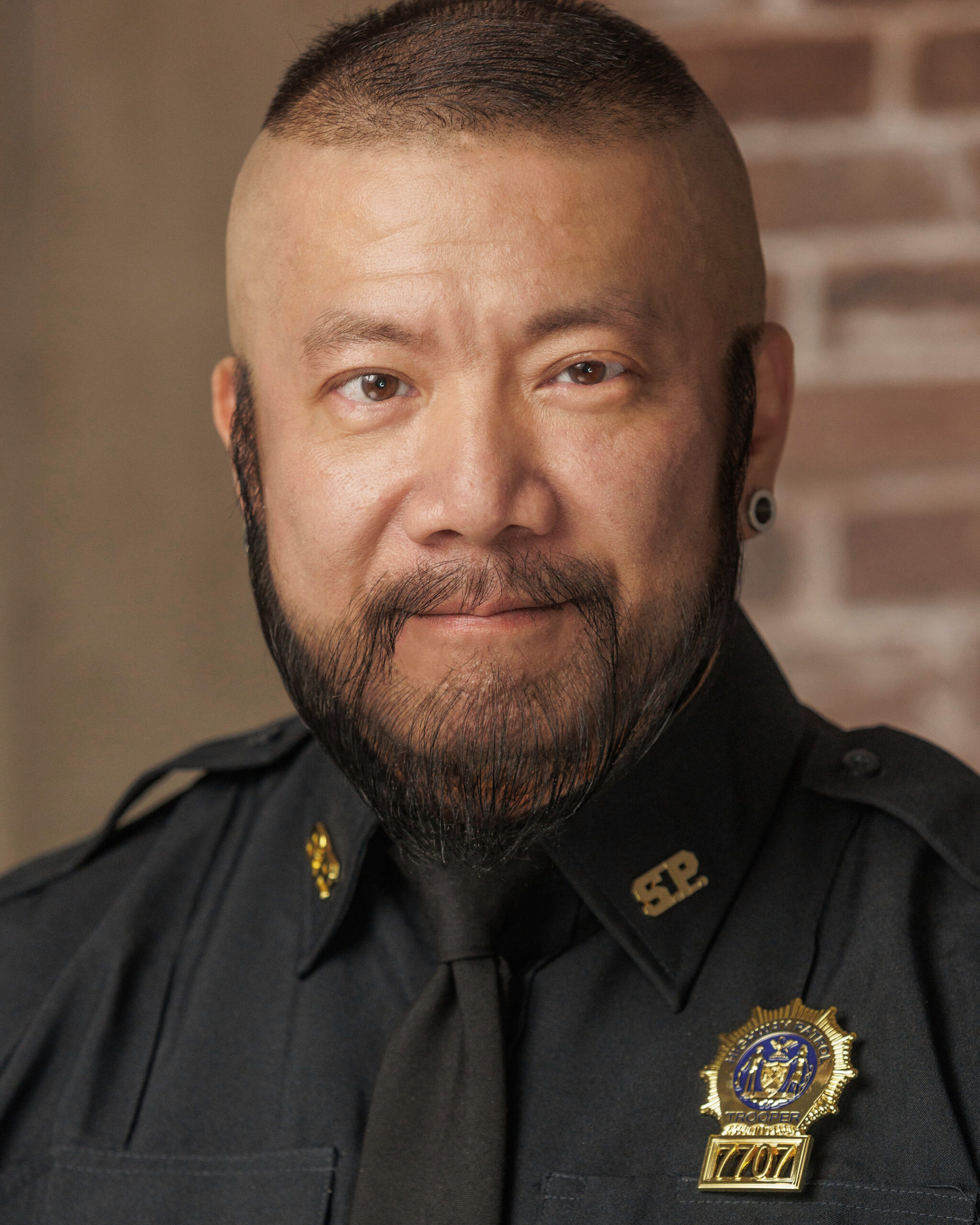 Harry Konner's Headshot: Police - Smile